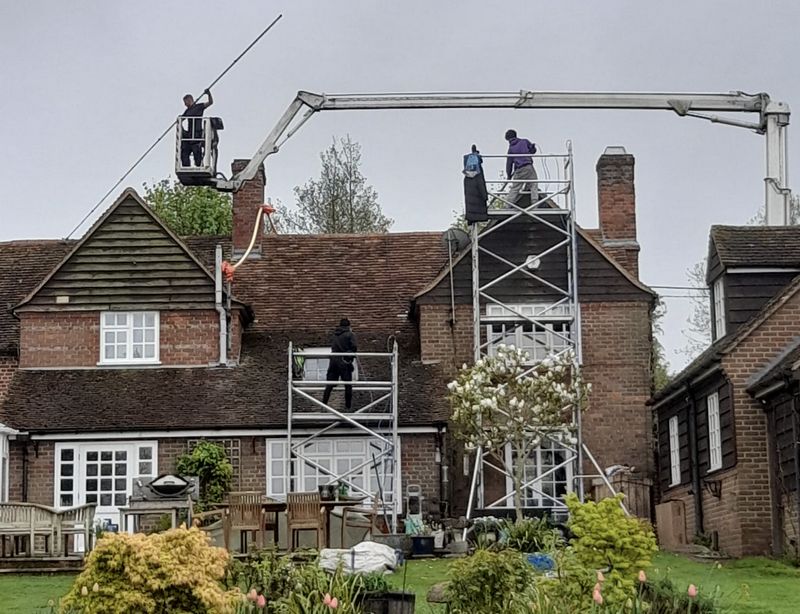 The Roof Moss Cleaners using cherry picker and scaffolding to clean roof safely and professionally in Princes Risborough, Buckinghamshire